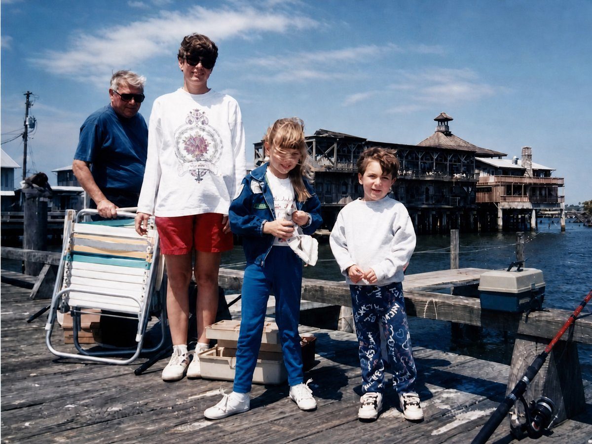 Lauren as a child on Dock Street in Cedar Key in 1997, with family and the old stilt-built waterfront in the background